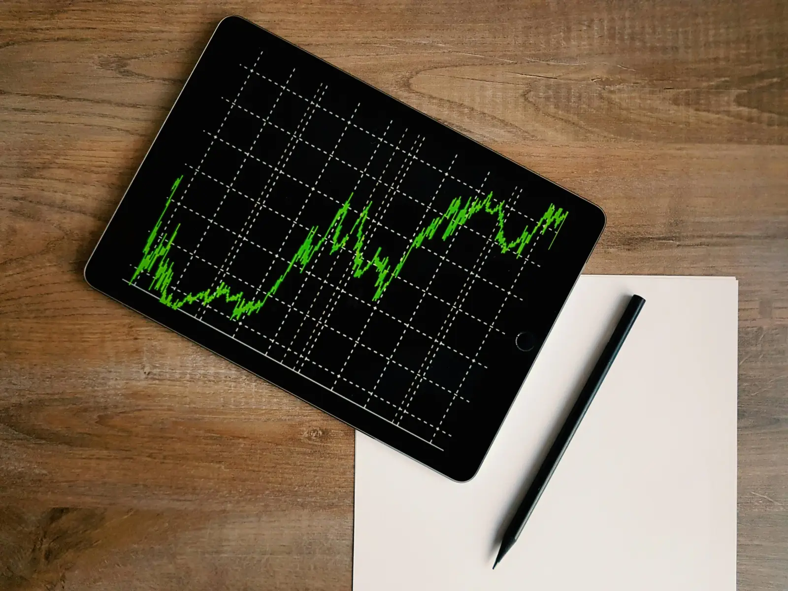 Home Website traffic growth chart shown on a laptop screen.