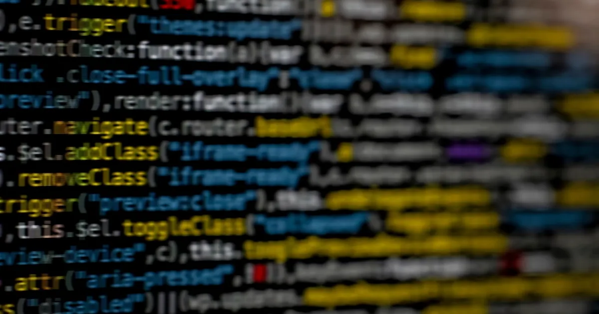 Code on a dark screen, a sign of a hacked WordPress site
